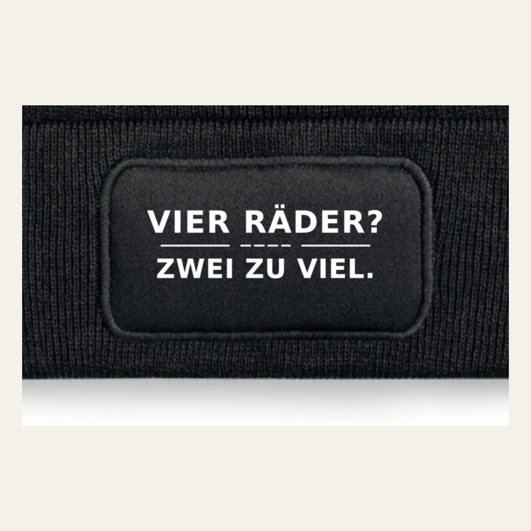 Detailansicht des Motivs VIER RÄDER? ZWEI ZU VIEL.