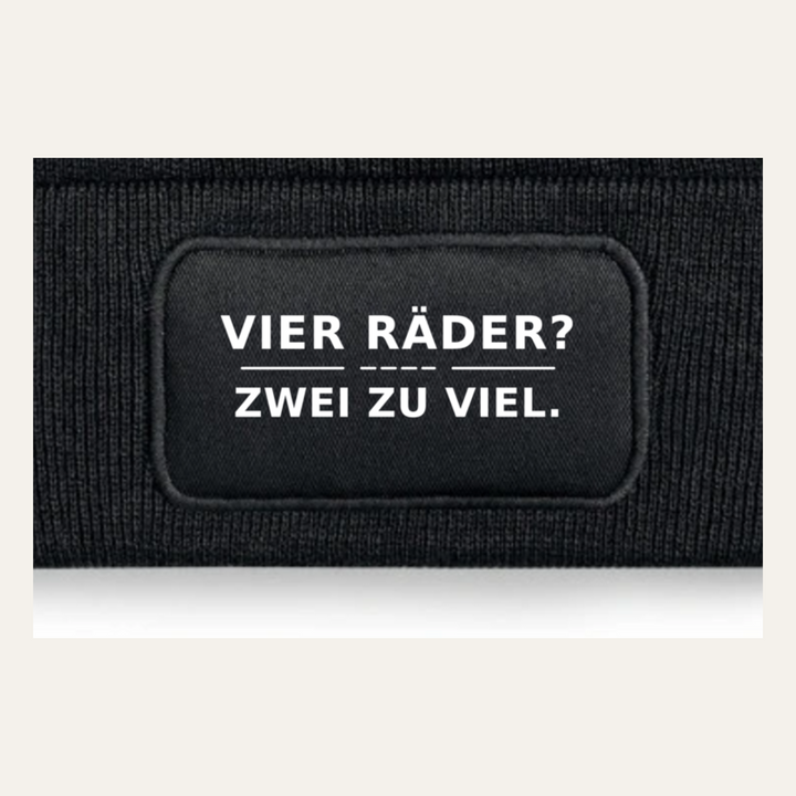 Detailansicht des Motivs VIER RÄDER? ZWEI ZU VIEL.