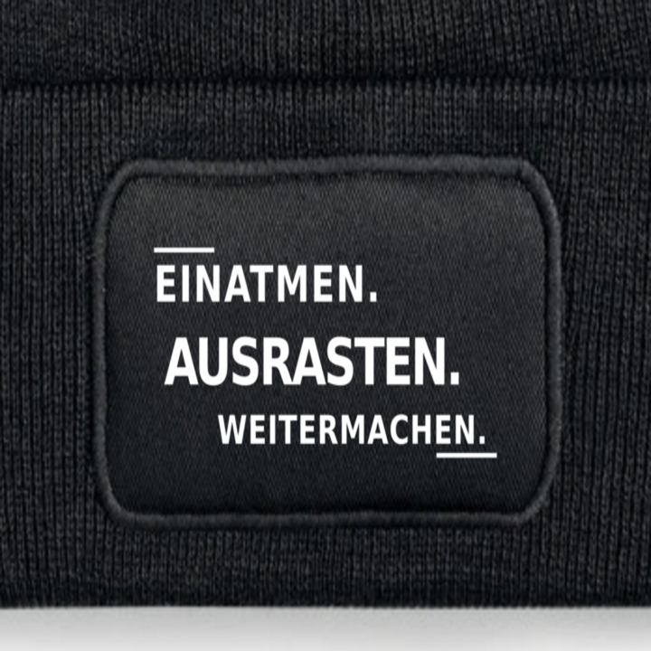 Detailansicht des Aufdrucks EINATMEN. AUSRASTEN. WEITERMACHEN.