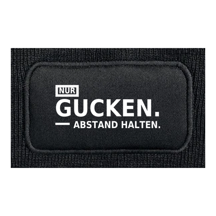 Detailansicht des Aufdrucks NUR GUCKEN. ABSTAND HALTEN.