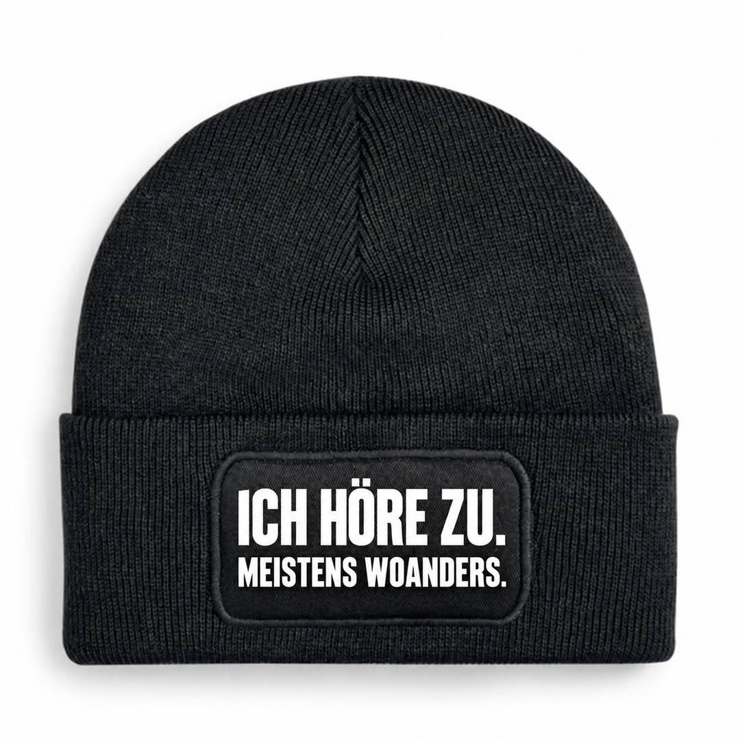 PEPAM Mütze „ICH HÖRE ZU. MEISTENS WOANDERS.“ – Schwarz
